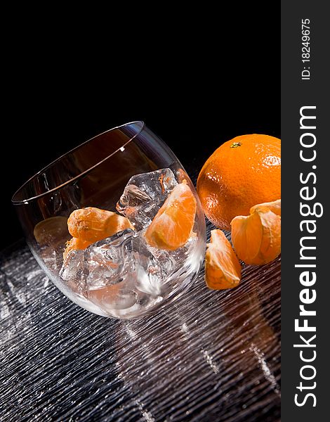 Photo of delicious orange mandarins on ice cubes. Photo of delicious orange mandarins on ice cubes