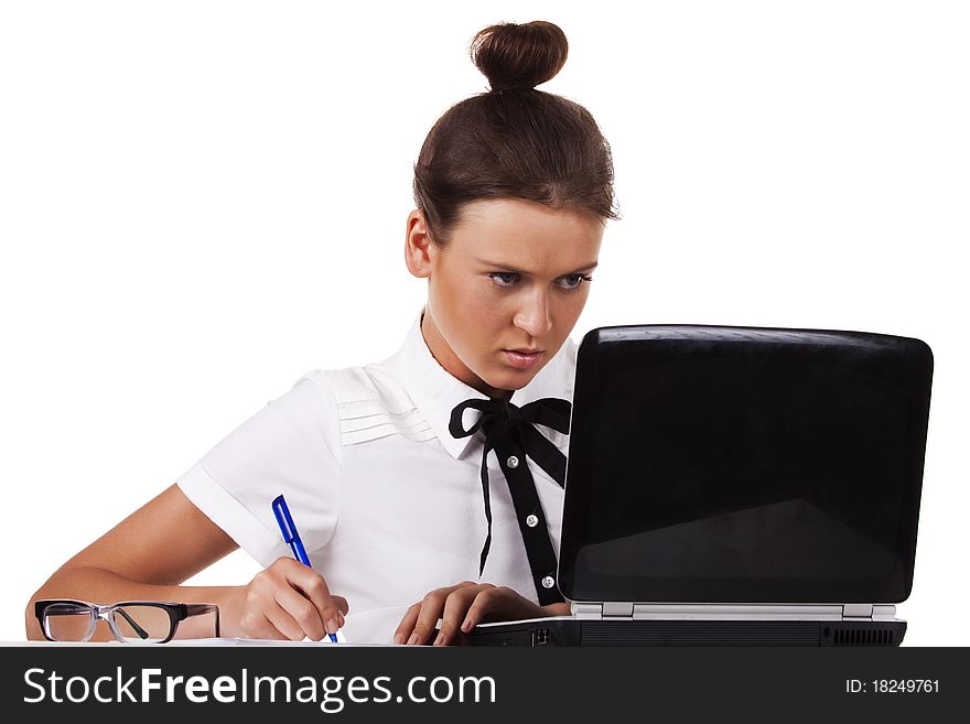 Woman with glasses sits at a table and working on laptop A series of office work