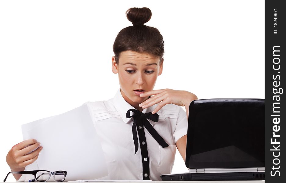 Woman Sitting Behind A Desk Through The Documents