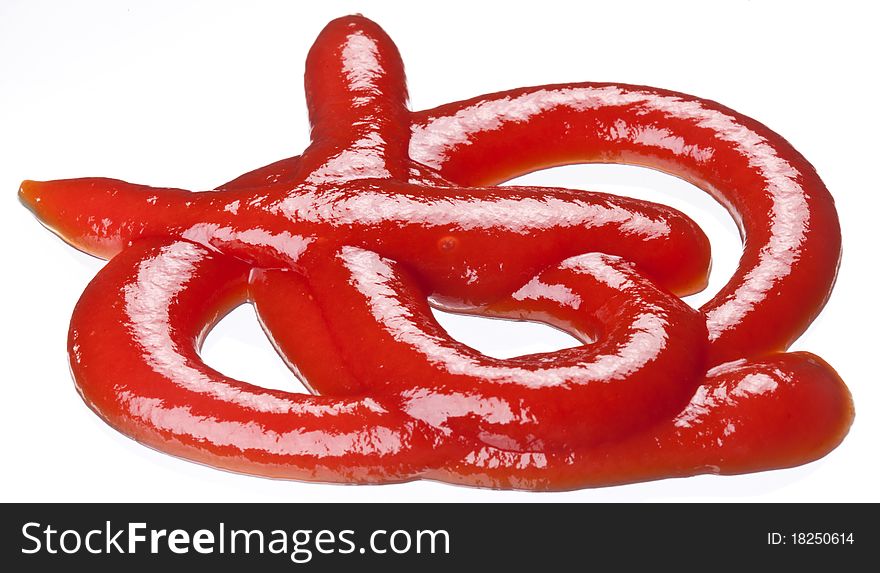 Portion of ketchup isolated on a white background. Portion of ketchup isolated on a white background.