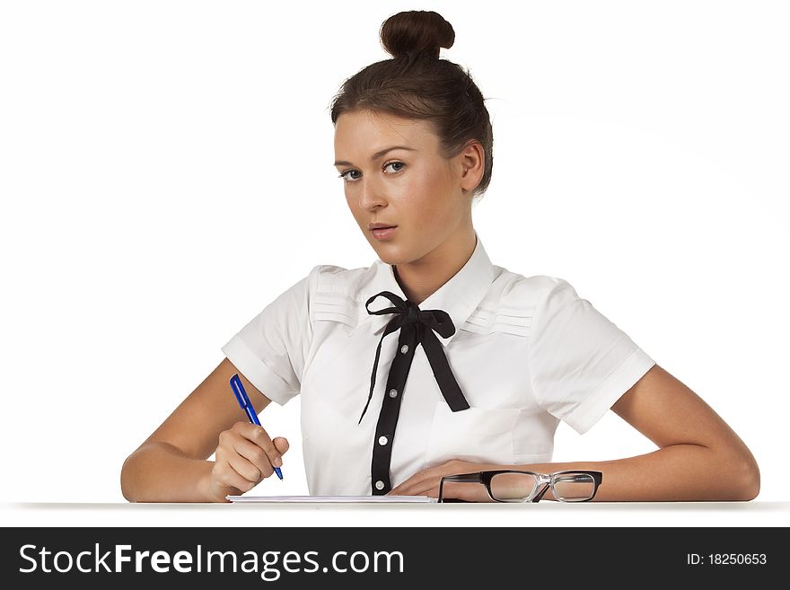 Brunette sitting at the table working with documents and thoughtful. A series of friendly office. Brunette sitting at the table working with documents and thoughtful. A series of friendly office