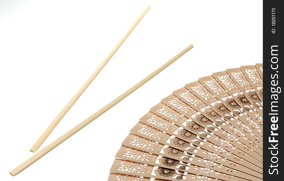Chopsticks and fan isolated on white