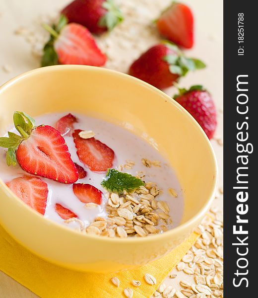 Yogurt breakfast with strawberry and oatmeal