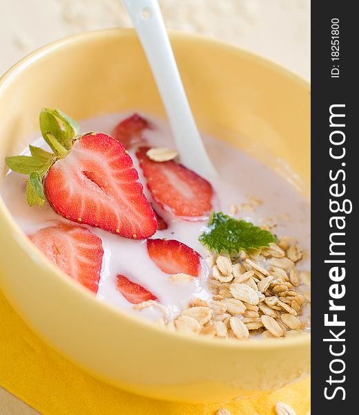 Yogurt breakfast with strawberry and oatmeal