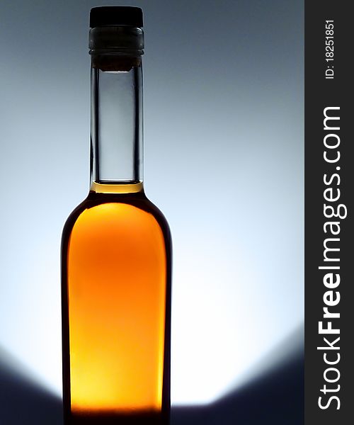 Bottle of cognac on white background