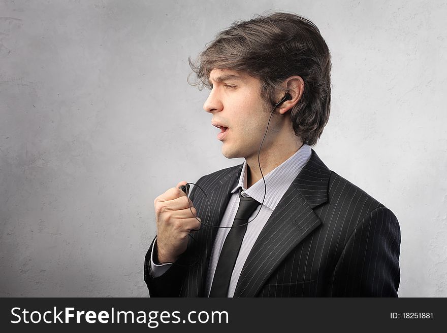 Businessman talking to telephone with a headset. Businessman talking to telephone with a headset
