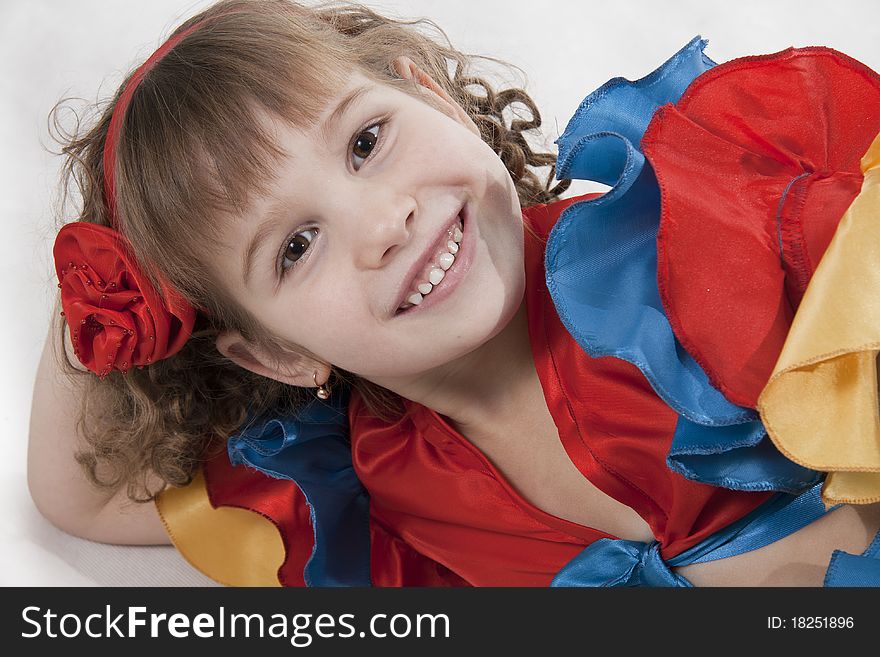 Portrait of the little girl dancer to a white background. Portrait of the little girl dancer to a white background