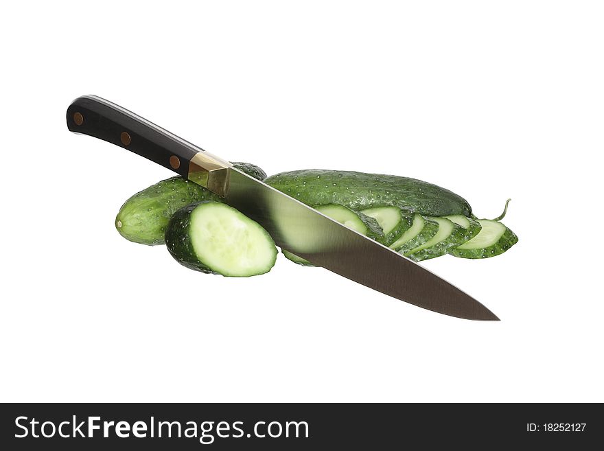 Kitchen knife cutting cucumber. Isolated on white with clipping path. Kitchen knife cutting cucumber. Isolated on white with clipping path