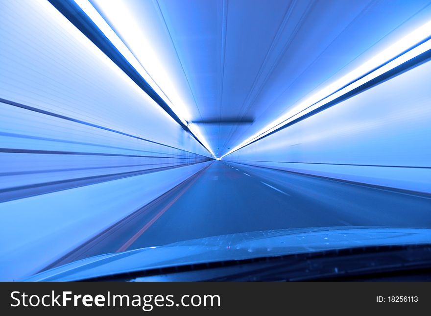 Fast drive through  a tunnel in blue color tone. Fast drive through  a tunnel in blue color tone