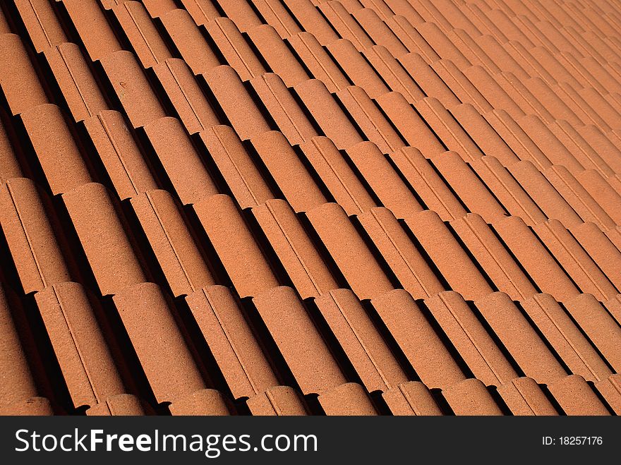 Red roof tiles pattern photo.