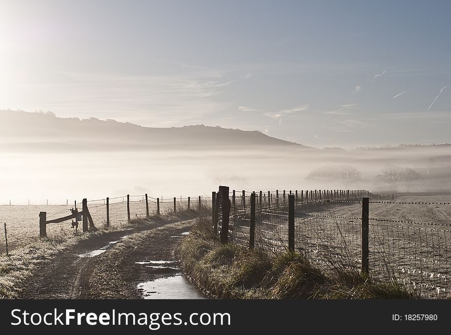 Mist over farmland on a winters morning. Mist over farmland on a winters morning