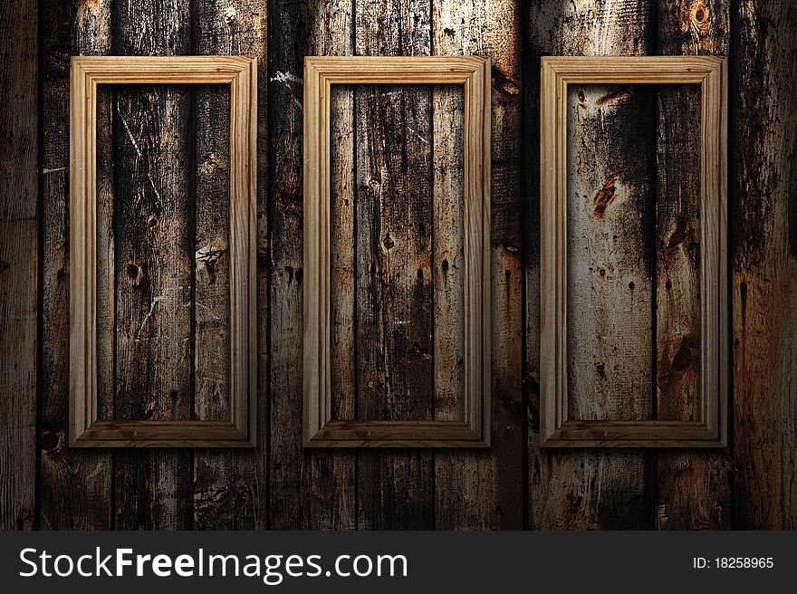 Empty frames on wooden background