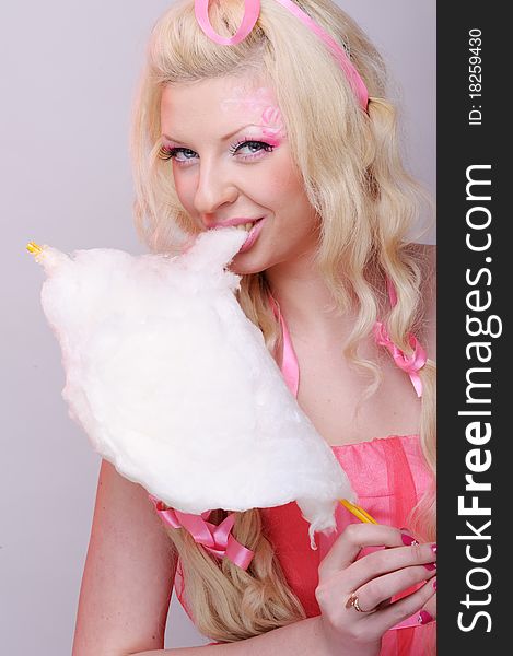 Woman with tasty cotton candy. Woman with tasty cotton candy