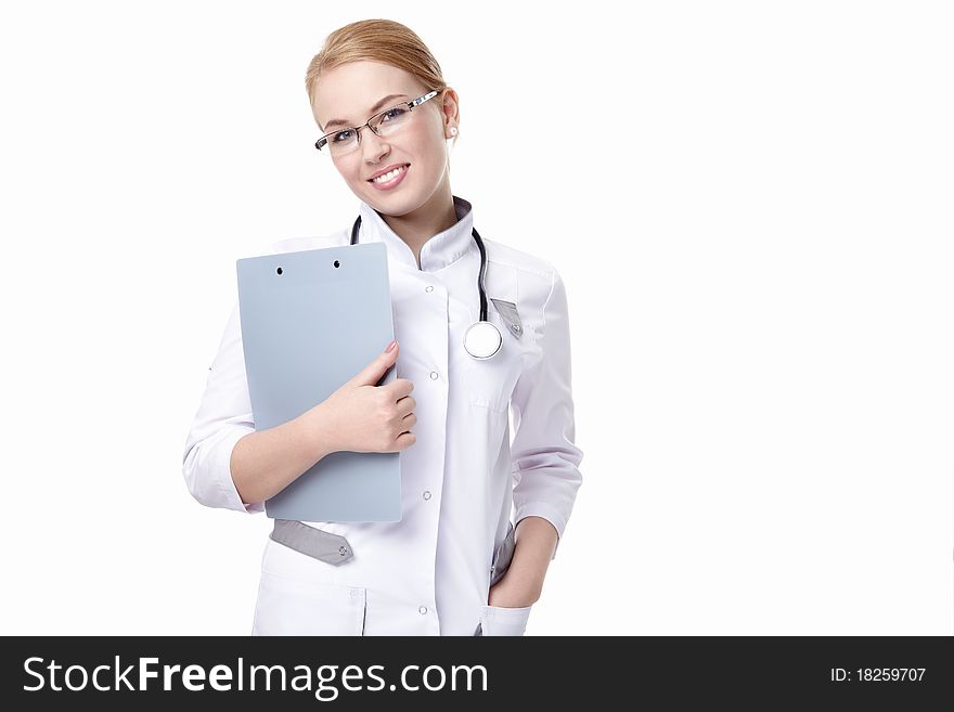 Attractive doctor with a clipboard and a stethoscope on a white background