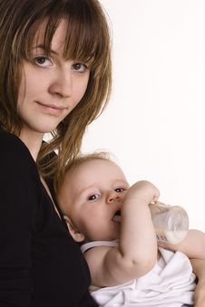 Mother Feeding Her Baby Stock Image