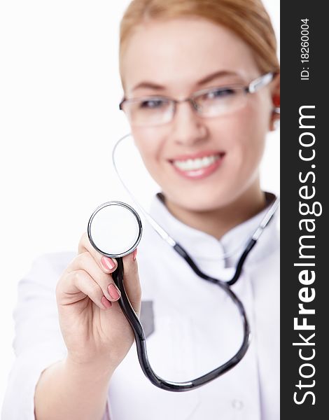 A young nurse with a stethoscope on a white background. A young nurse with a stethoscope on a white background