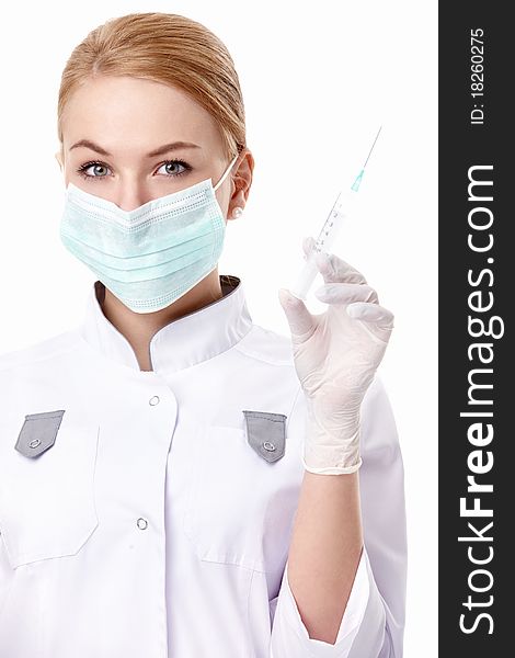 A young doctor with a syringe on white background. A young doctor with a syringe on white background