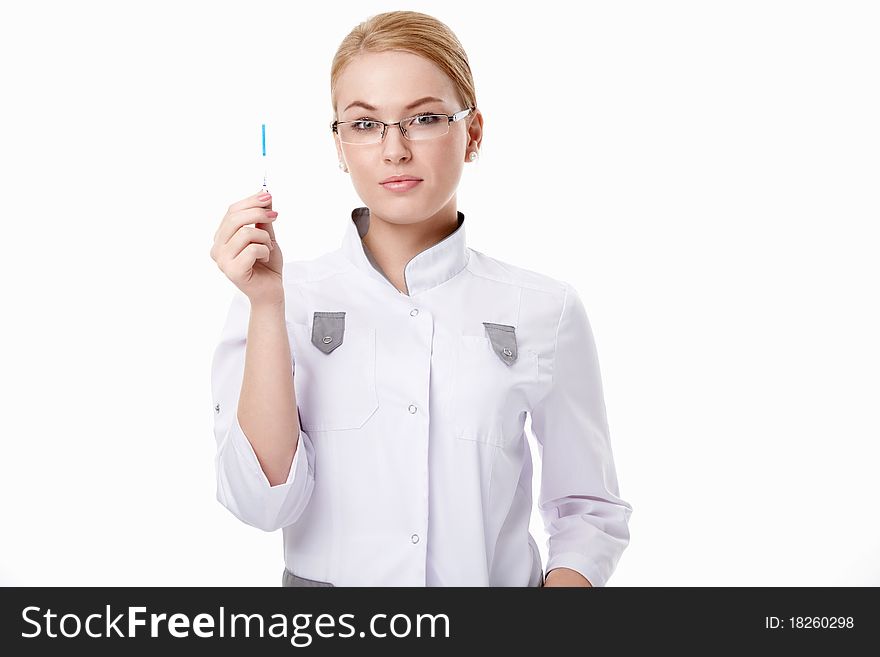 A young doctor with pregnancy tests on a white background