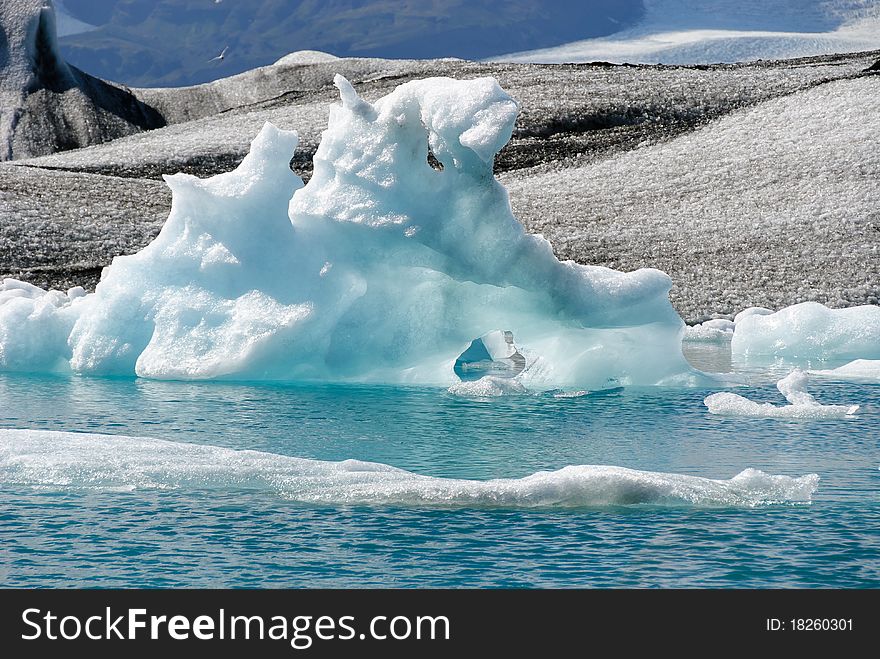 Iceberg reflections on the calm water of the lake Jokulsarlon. Iceberg reflections on the calm water of the lake Jokulsarlon