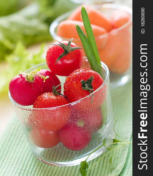 Fresh ripe vegetable in glasses on table. Fresh ripe vegetable in glasses on table