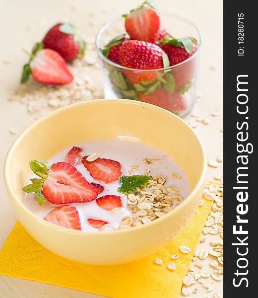 Breakfast yogurt with oatmeal and strawberry