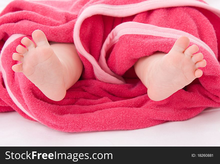 Legs baby in a towel.