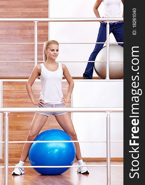 Attractive girl with a ball at the fitness club. Attractive girl with a ball at the fitness club