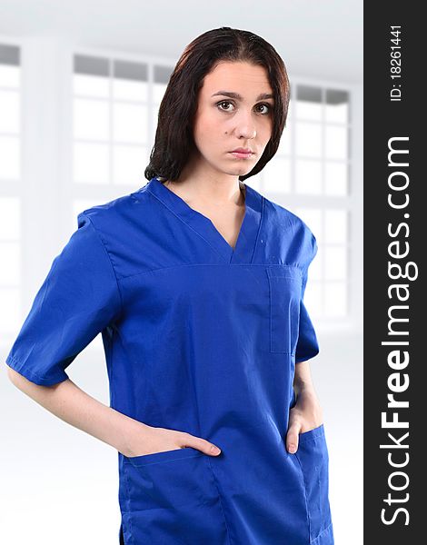 Young working beautiful woman doctor in uniform