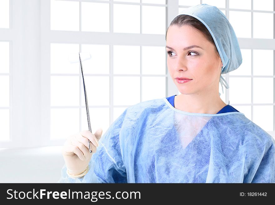 Young working beautiful woman doctor in uniform
