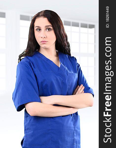 Young working beautiful woman doctor in uniform