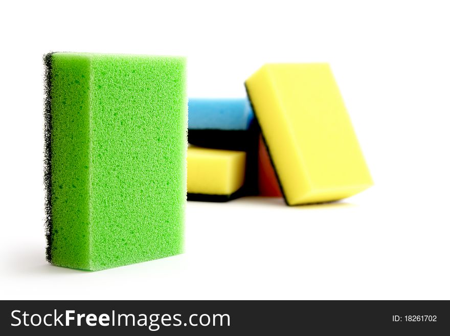 Highlights many-colored sponges isolated on white