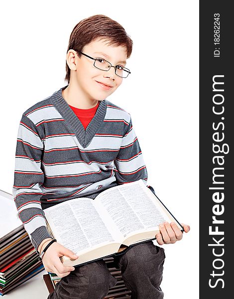 Educational theme: portrait of a schoolboy with books. Isolated over white background. Educational theme: portrait of a schoolboy with books. Isolated over white background.
