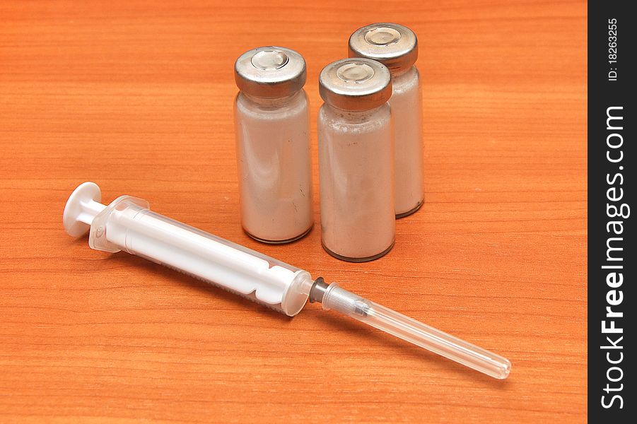 Medicine vials and syringe