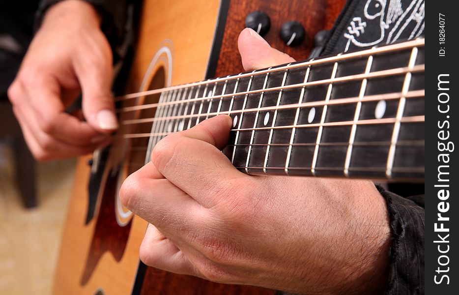Hands playing guitar in diagonal position. Hands playing guitar in diagonal position