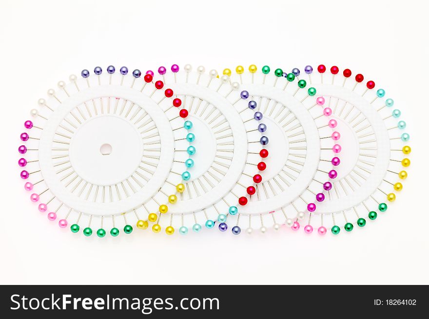 Colorful pins isolated on white background