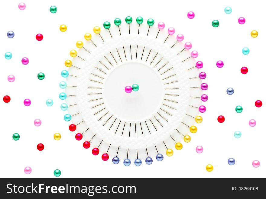 Colorful pins isolated on white background