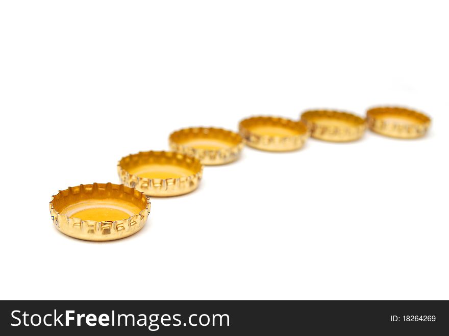 The golden beer caps drinking