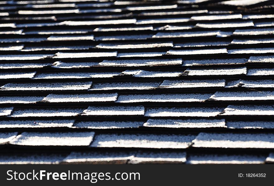 Frost on composite roof shingles creates a repeating pattern. Frost on composite roof shingles creates a repeating pattern.