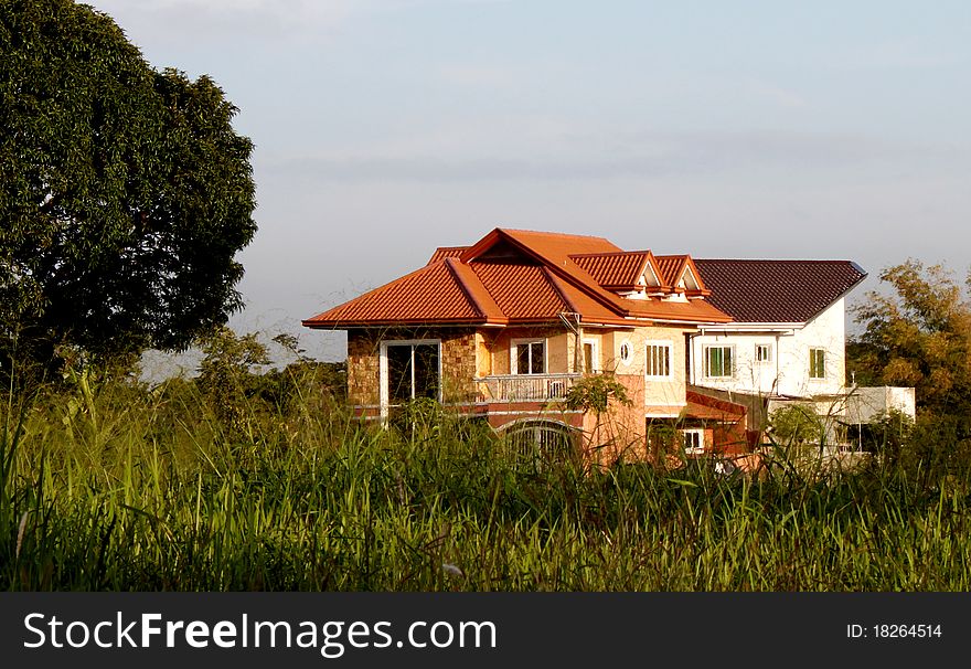 Modern beautiful house isolated in a grassland. Modern beautiful house isolated in a grassland