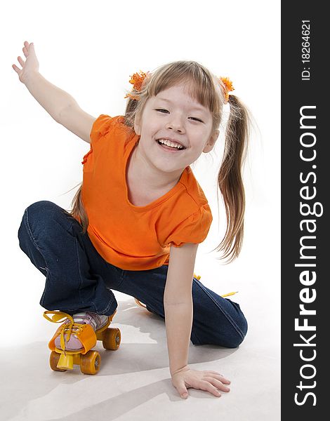 The little girl on roller skates. Isolated white