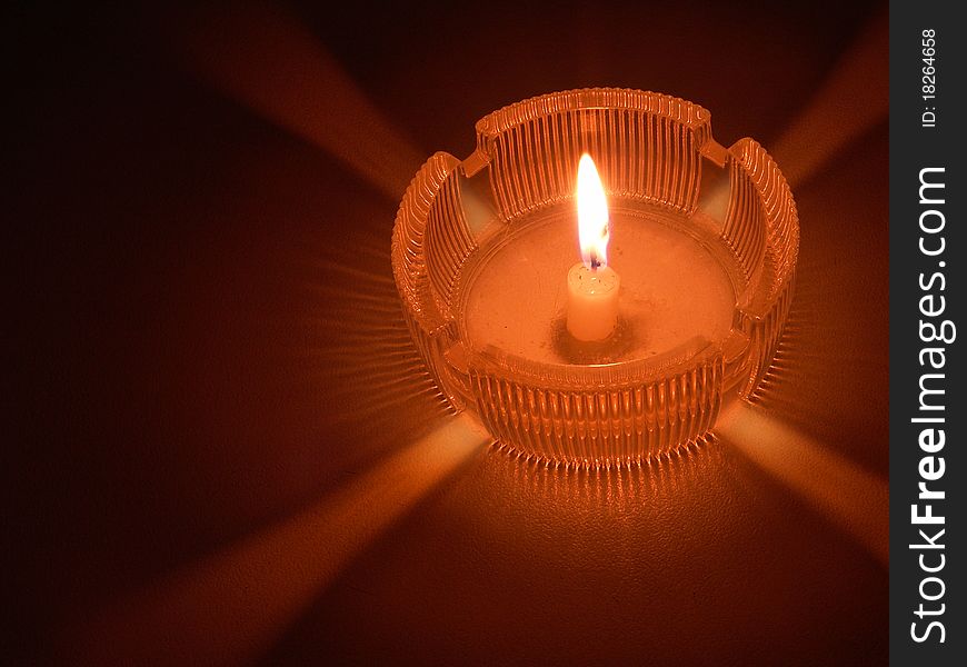 Burning Candle in an ashtray