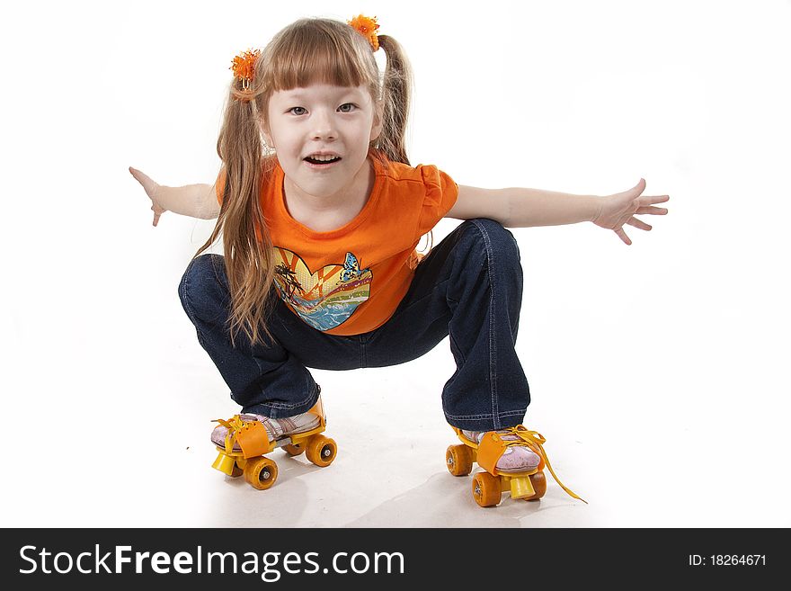 The little girl on roller skates. Isolated white