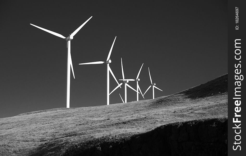 Wind generators strand on the hill creating electricity. Wind generators strand on the hill creating electricity