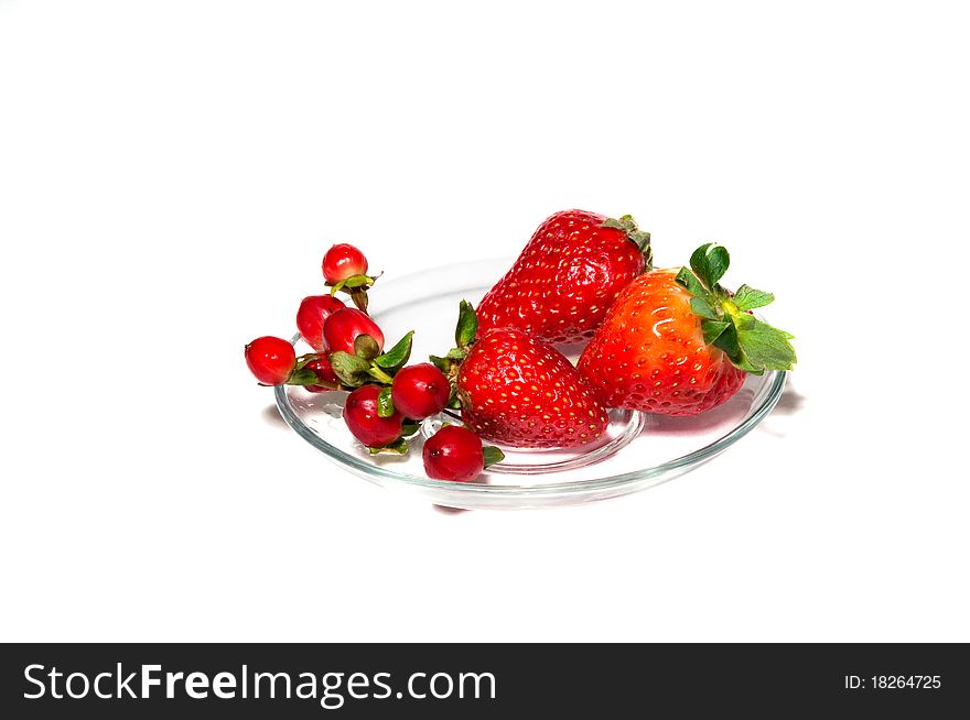 Berries red on a glass plate. Berries red on a glass plate