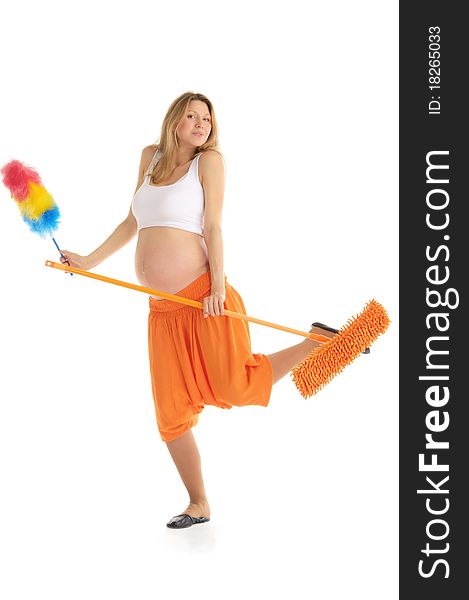 Happy pregnant woman with a mop and brush