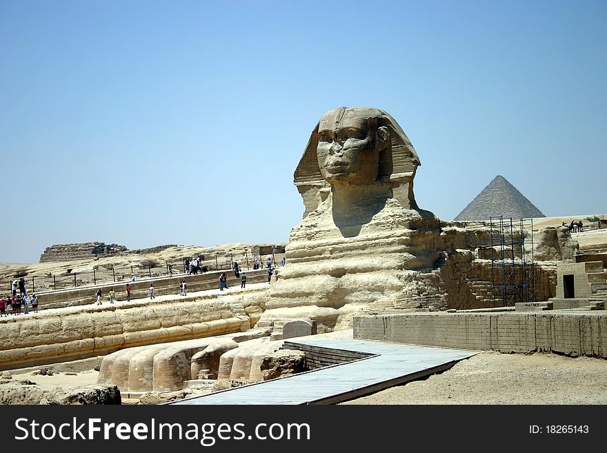 The Sphinx found in Cairo, Egypt with desert and pyramids in the background. The Sphinx found in Cairo, Egypt with desert and pyramids in the background.