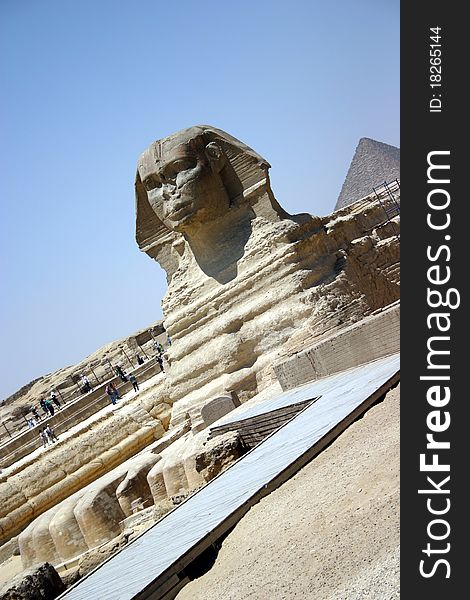 The Sphinx found in Cairo, Egypt with desert and pyramids in the background. The Sphinx found in Cairo, Egypt with desert and pyramids in the background.