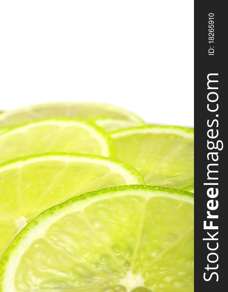 A closeup shot of a sliced lime on a white background with copy space. A closeup shot of a sliced lime on a white background with copy space