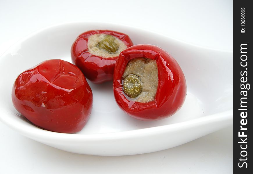 Stuffed peppers in a white bowl.