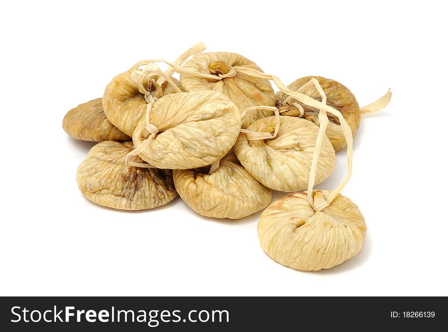 Dried figs on a string isolated on a white background